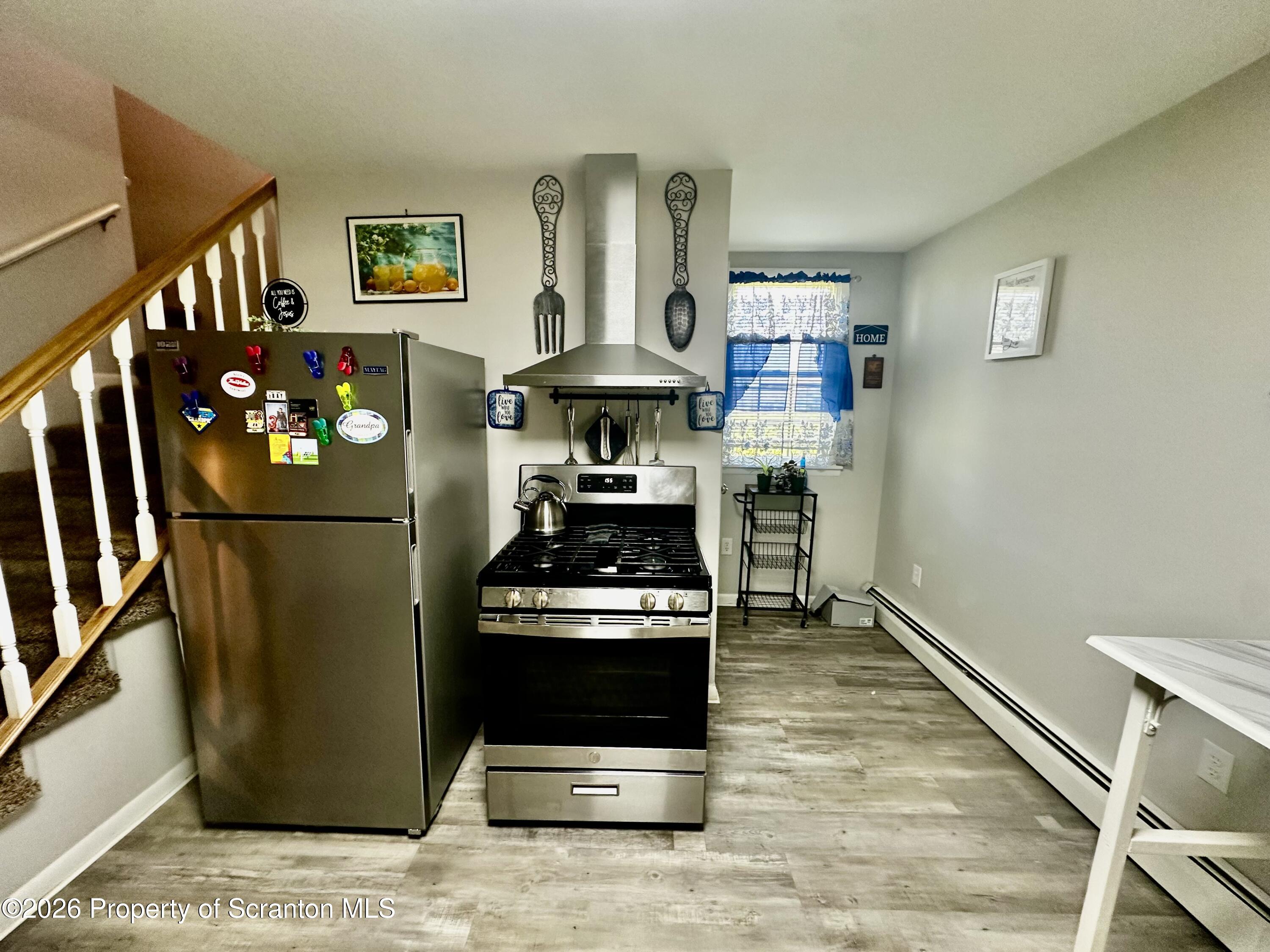 1727 Bulwer Street Scranton, PA 18504 - Photo 12 of 40 a kitchen with stainless steel appliances granite countertop a refrigerator stove and sink