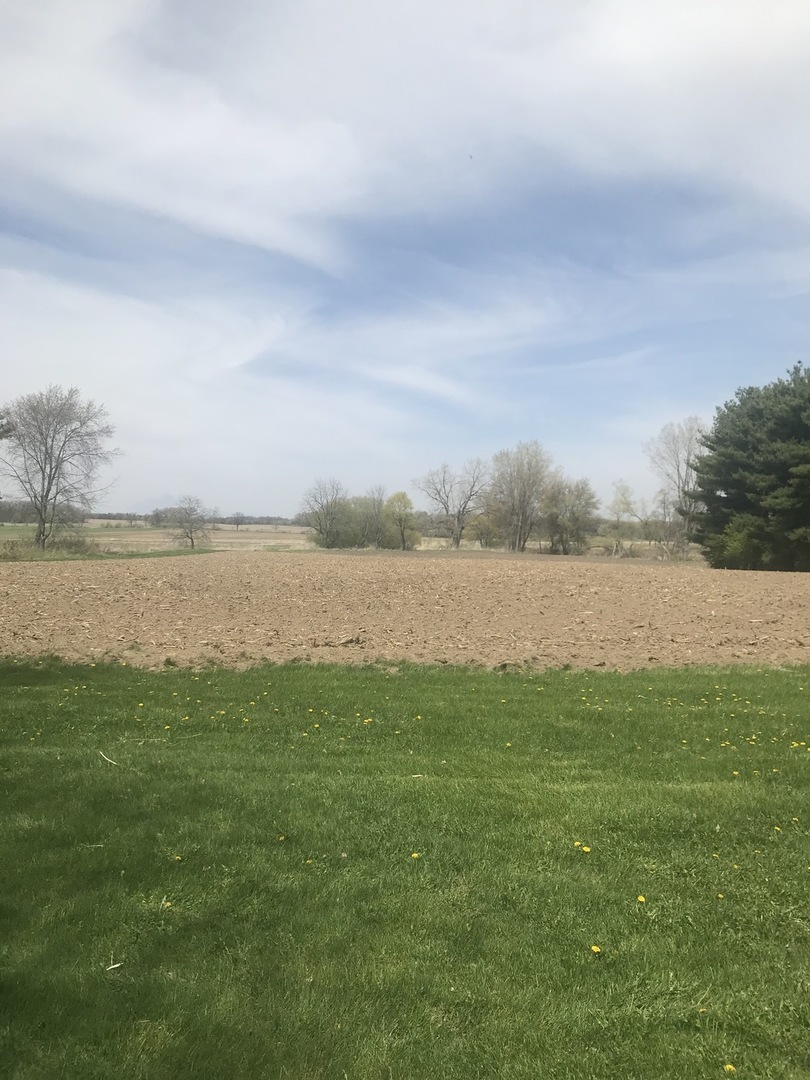 17204 Altenburg Road Harvard, IL 60033 - Photo 22 of 22 a view of a lake with houses in the background