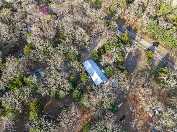 a backyard of a house with a yard and outdoor seating