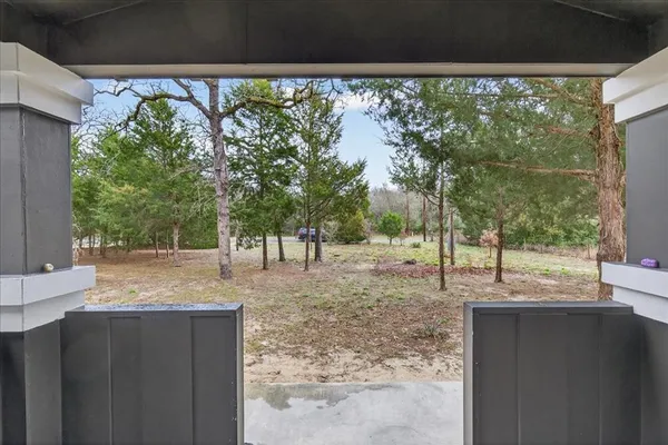 a backyard of a house with a tree