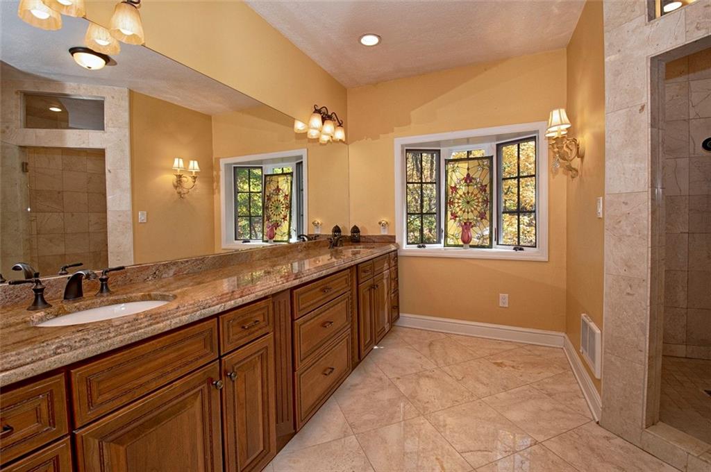 105 Lantern Circle McMurray, PA 15317 - Photo 11 of 25 a spacious bathroom with a granite countertop double vanity sink a mirror and a