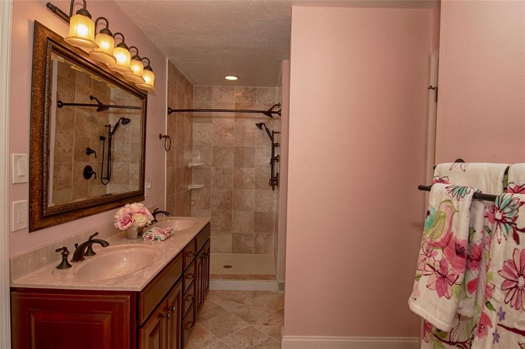 105 Lantern Circle McMurray, PA 15317 - Photo 13 of 25 a bathroom with a sink vanity granite and shower