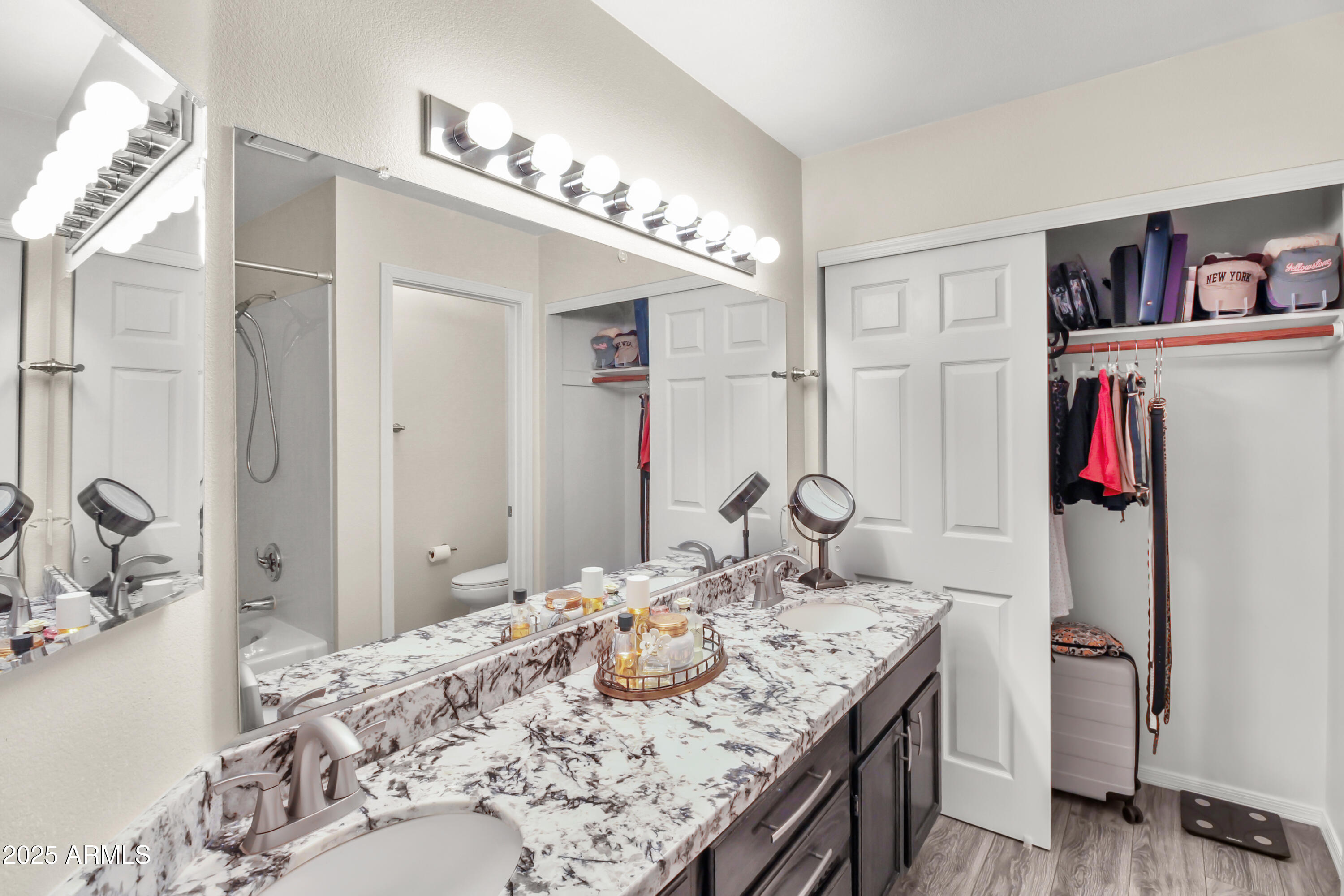 1122 West Sandy Banks Gilbert, AZ 85233 - Photo 19 of 22 a en suite bathroom with a granite countertop sink and a mirror