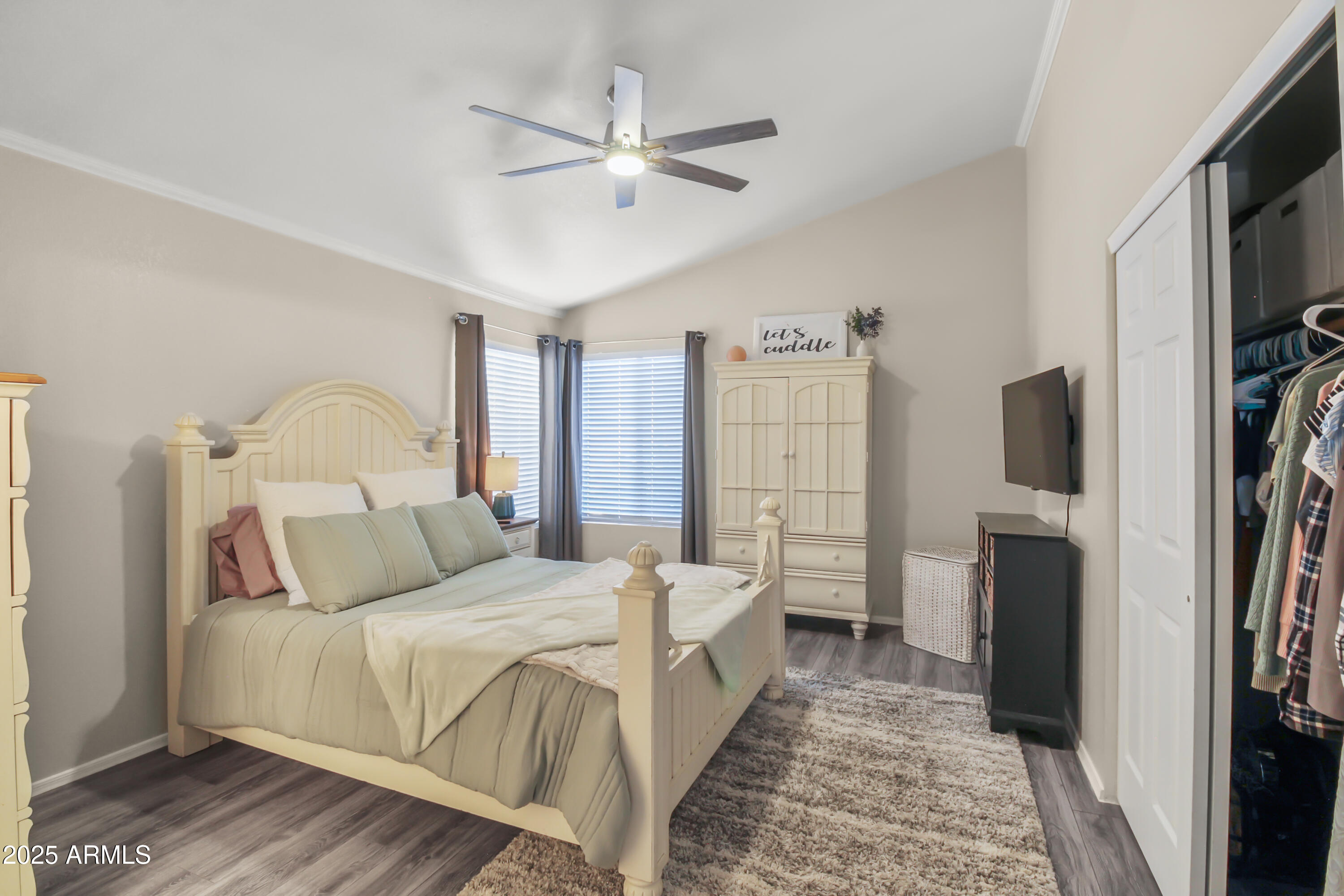 1122 West Sandy Banks Gilbert, AZ 85233 - Photo 20 of 22 a bedroom with a bed flat screen tv and a window