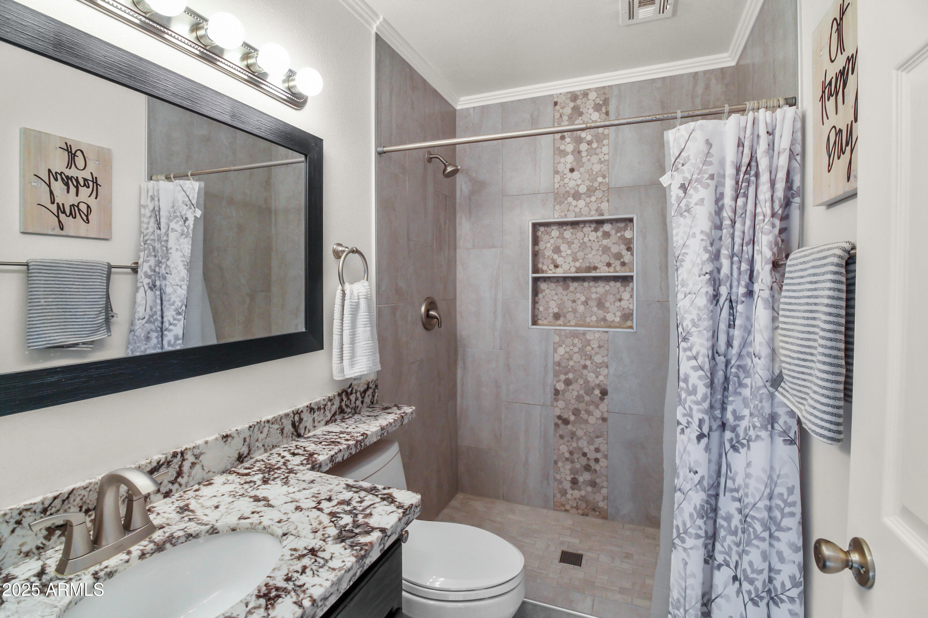 1122 West Sandy Banks Gilbert, AZ 85233 - Photo 21 of 22 a bathroom with a shower curtain and a sink