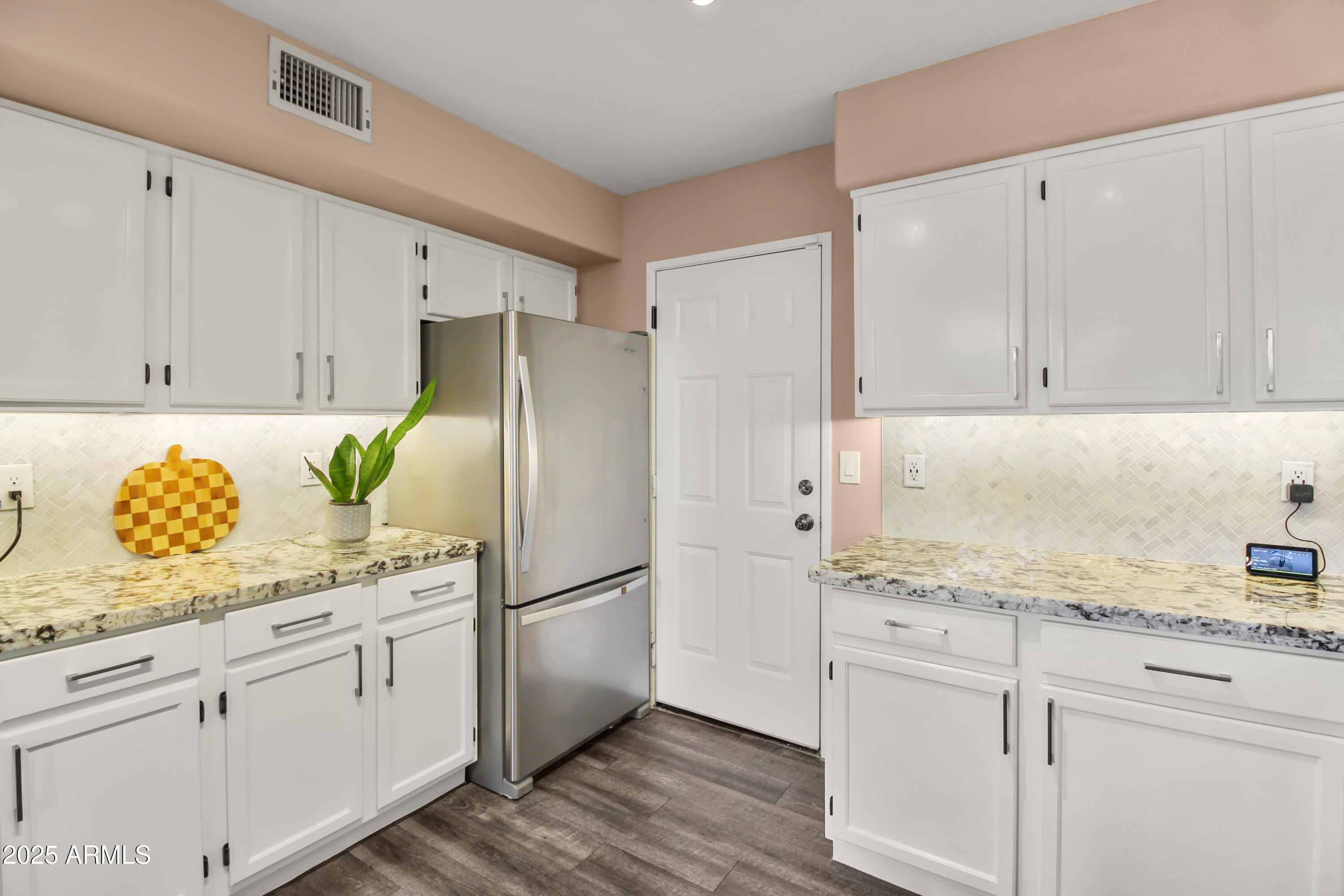 1122 West Sandy Banks Gilbert, AZ 85233 - Photo 10 of 22 a kitchen with appliances cabinets and center island