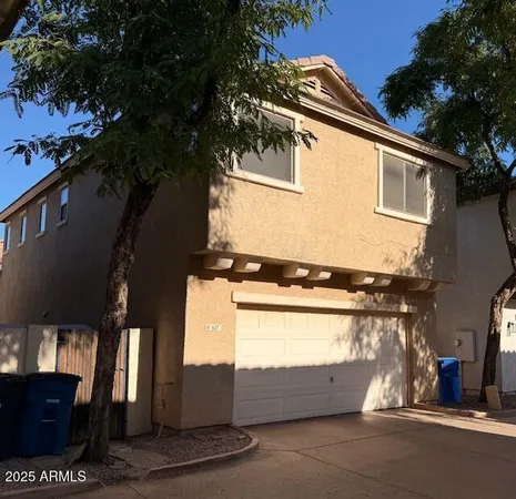 a view of a house with a street