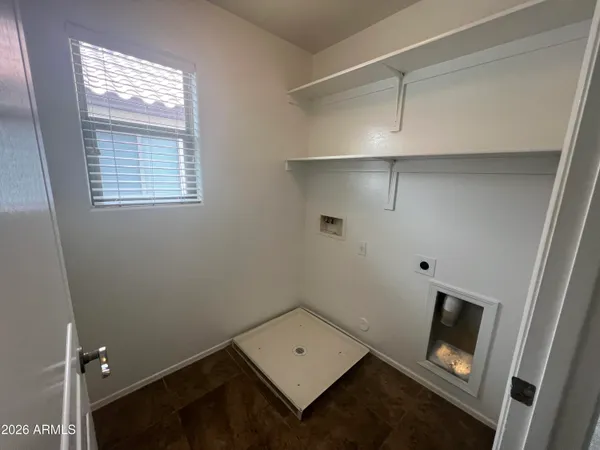 a room with an empty space and a window