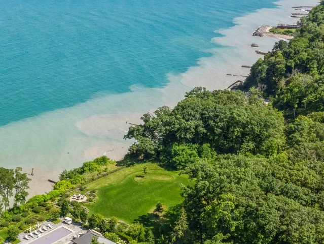 a view of a lake with a yard