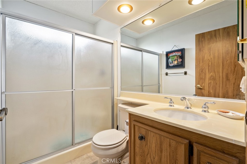 334 Bobwhite Drive Paso Robles, CA 93446 - Photo 17 of 23 a bathroom with a granite countertop sink toilet and shower