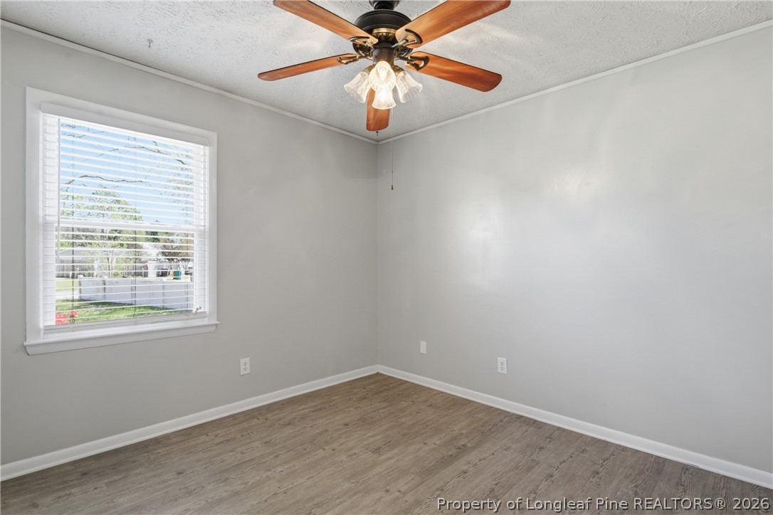 6319 Rustic Ridge Hope Mills, NC 28348 - Photo 31 of 39 an empty room with a window and a fan