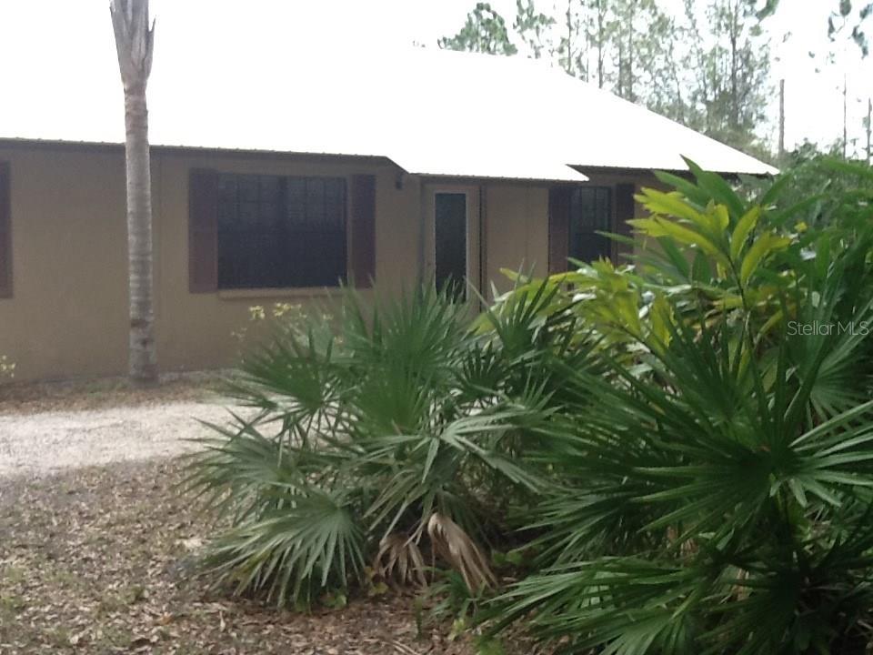 12290 Britt Road Parrish, FL 34219 - Photo 1 of 1 a backyard of a house