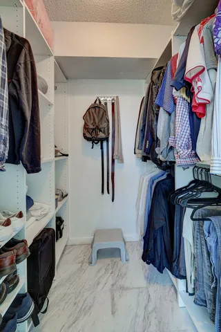 a bedroom with two beds and a window