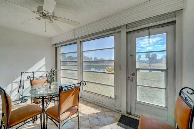 a front view of a house with a garden and plants