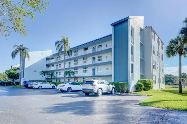 a view of front door of house with yard