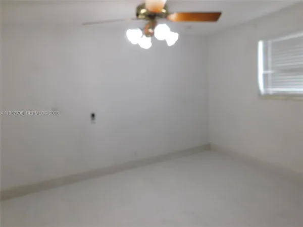 a view of small space with a fan