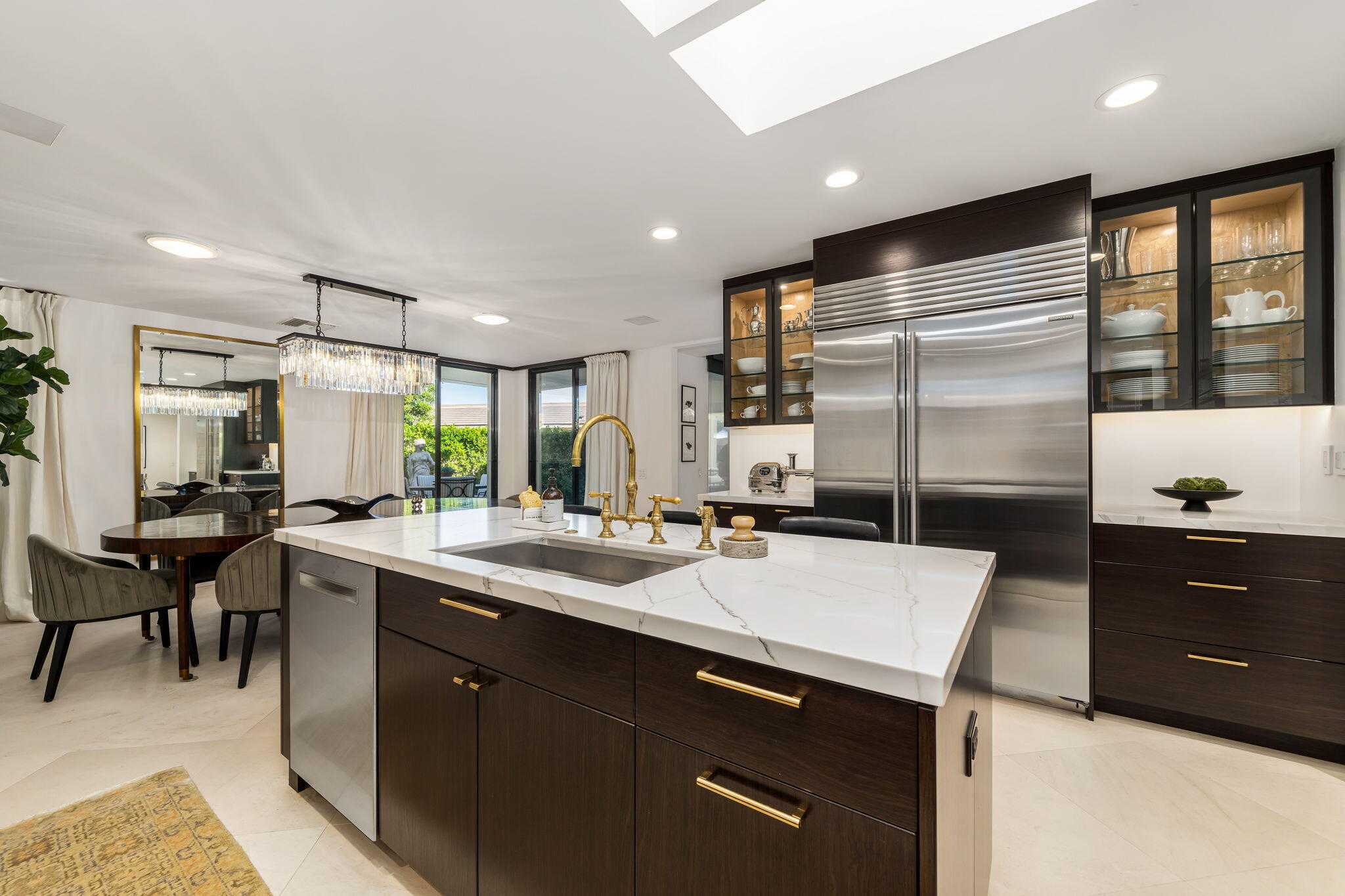 6 Exeter Court Rancho Mirage, CA 92270 - Photo 22 of 54 a kitchen with counter top space sink and center island