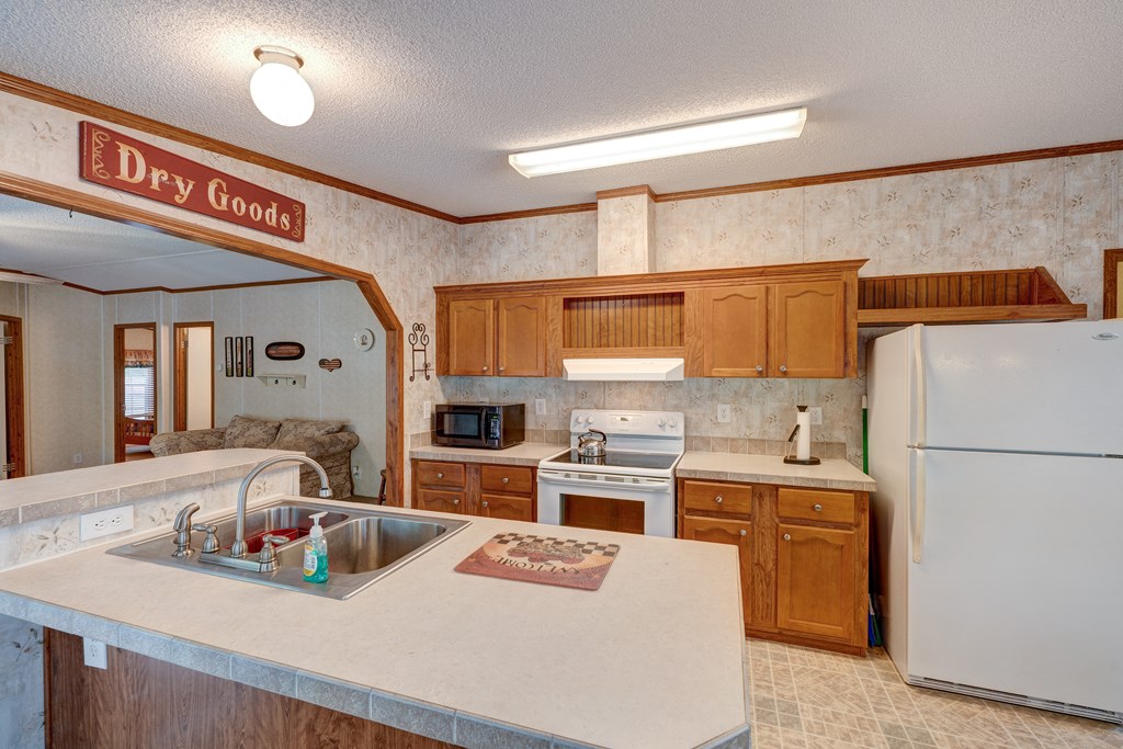 150 Hickory Hls Road Ellijay, GA 30540 - Photo 5 of 24 a kitchen with a sink a stove and cabinets