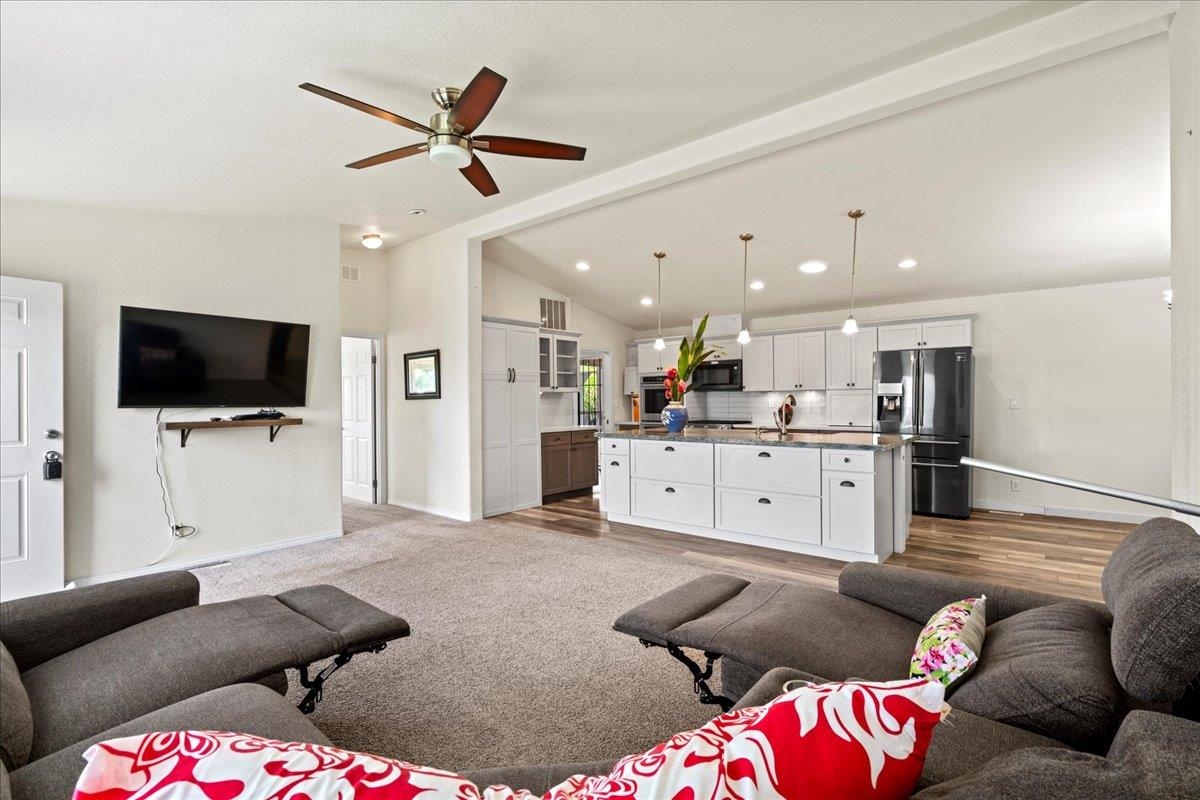 943 Kokomo Road Haiku, HI 96708 - Photo 12 of 50 a living room with furniture and a flat screen tv