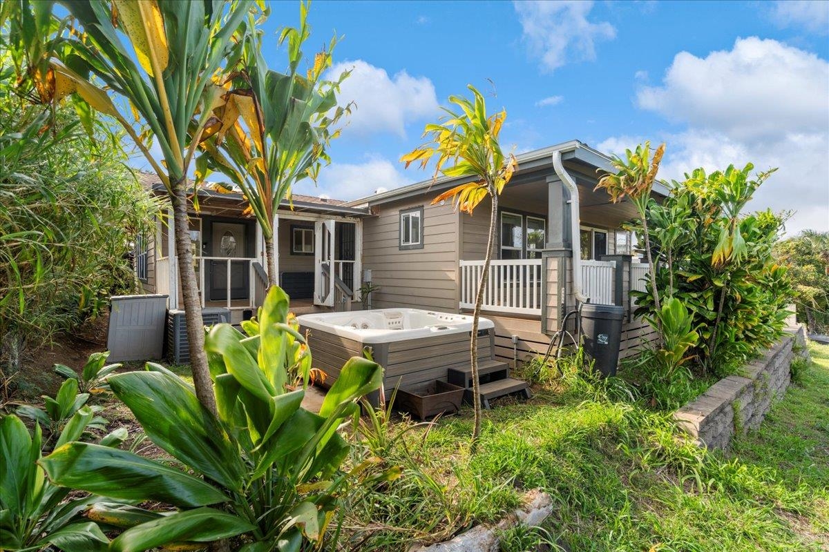 943 Kokomo Road Haiku, HI 96708 - Photo 37 of 50 a front view of a house with a garden