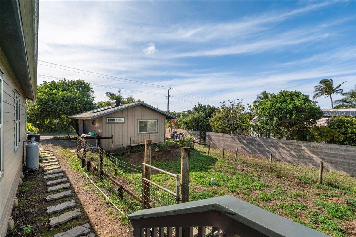 943 Kokomo Road Haiku, HI 96708 - Photo 38 of 50 a view of a house with wooden deck and furniture