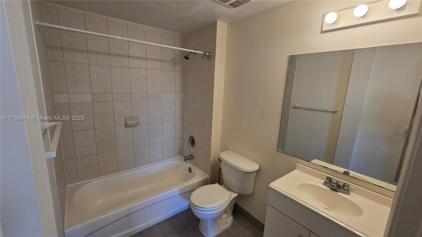 11060 Southwest 196th Street, Unit 407 Cutler Bay, FL 33157 - Photo 13 of 25 a bathroom with a sink and a toilet
