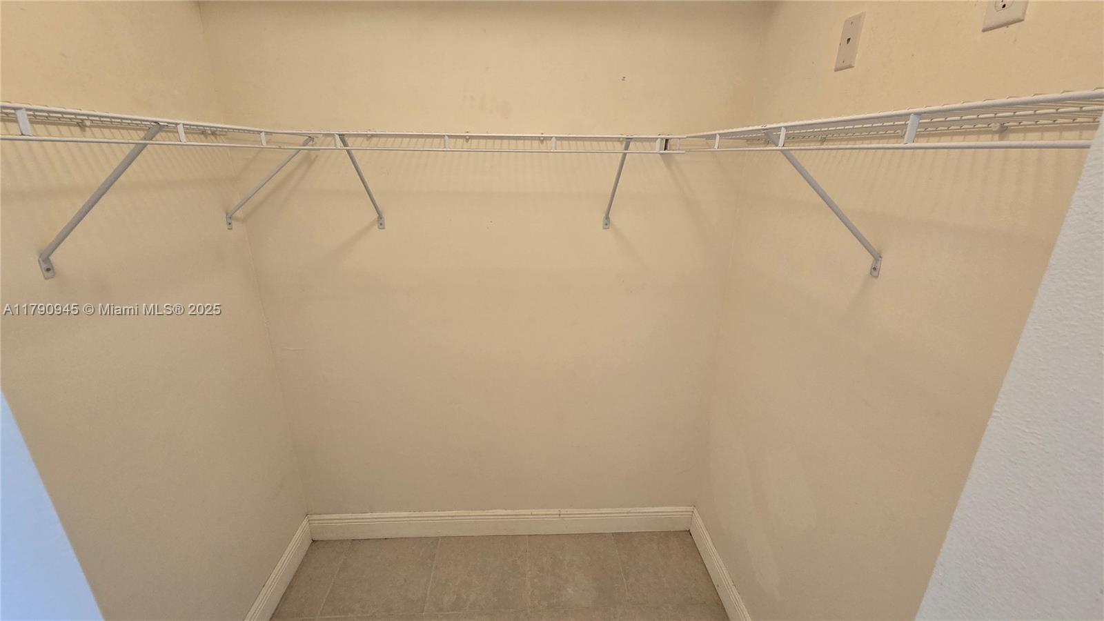 11060 Southwest 196th Street, Unit 407 Cutler Bay, FL 33157 - Photo 15 of 25 a view of small space with racks on the wall