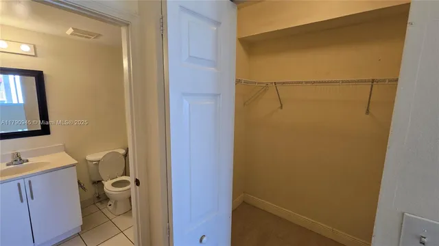 a bathroom with a shower and a sink