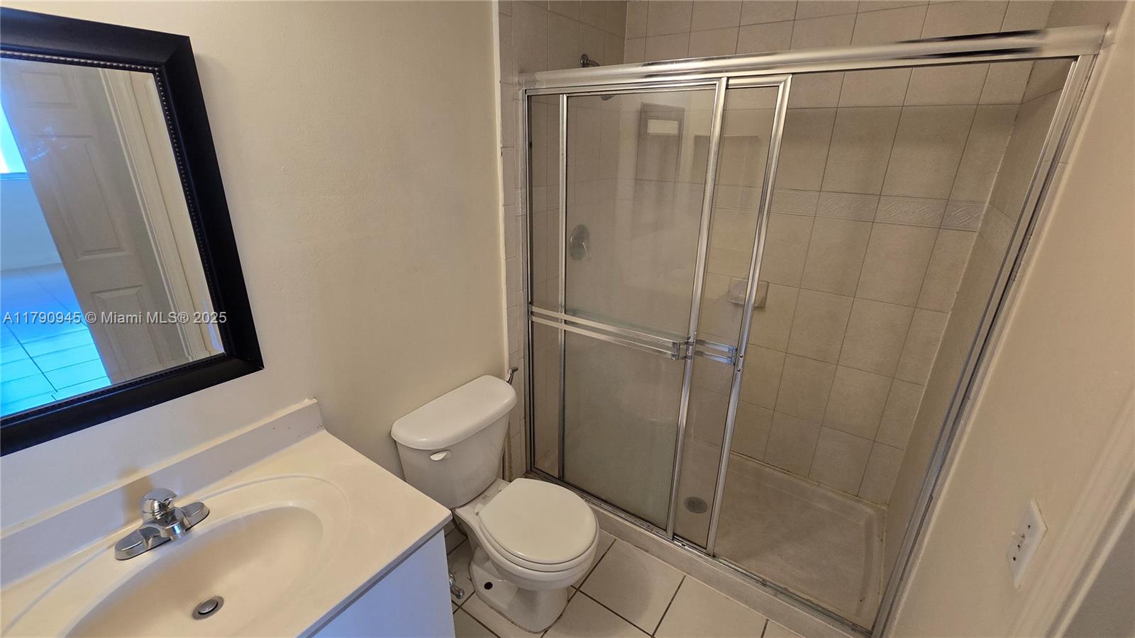 11060 Southwest 196th Street, Unit 407 Cutler Bay, FL 33157 - Photo 17 of 25 a bathroom with a sink and a toilet