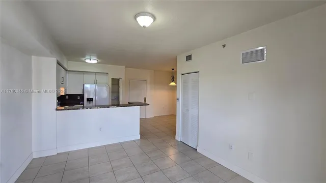 a view of a kitchen with a sink