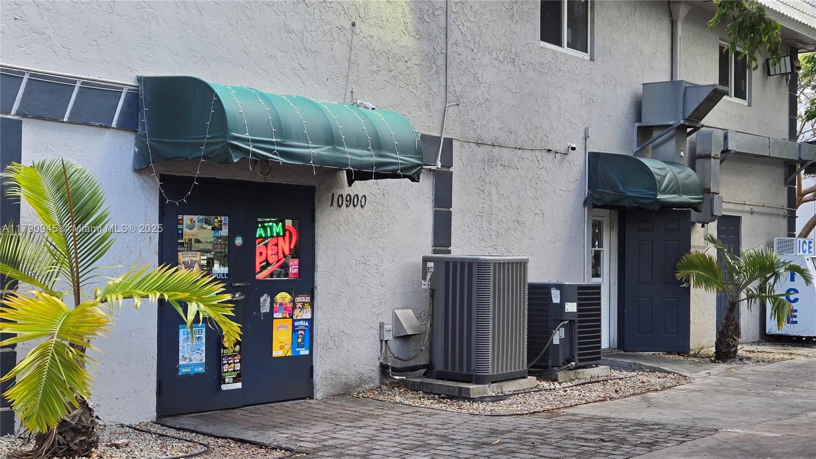 11060 Southwest 196th Street, Unit 407 Cutler Bay, FL 33157 - Photo 21 of 25 a view of a street with potted plants