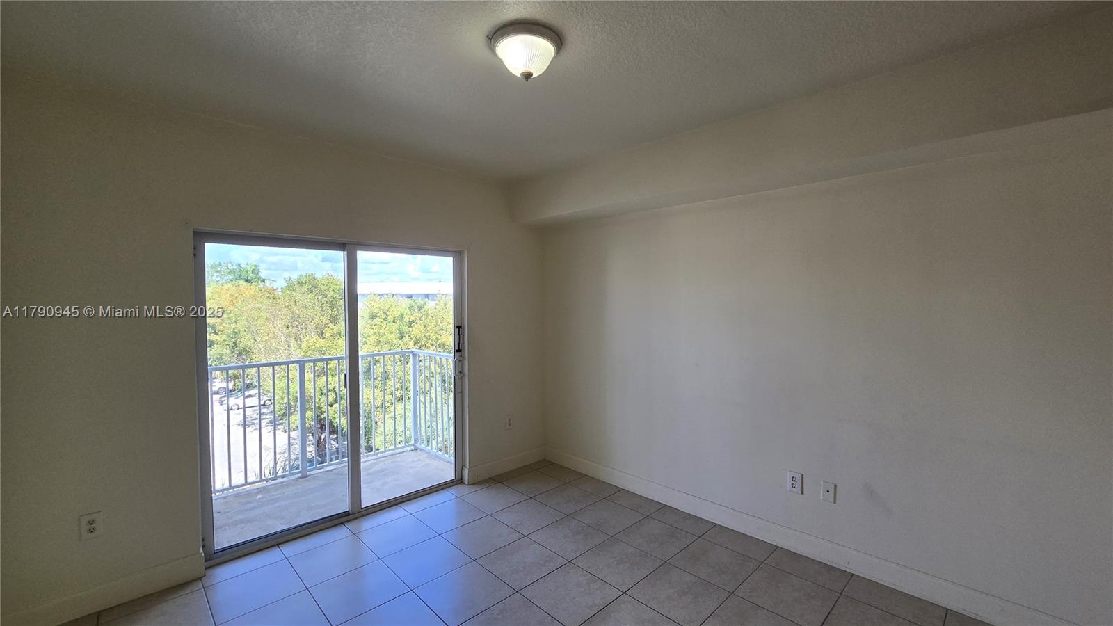11060 Southwest 196th Street, Unit 407 Cutler Bay, FL 33157 - Photo 7 of 25 an empty room with windows