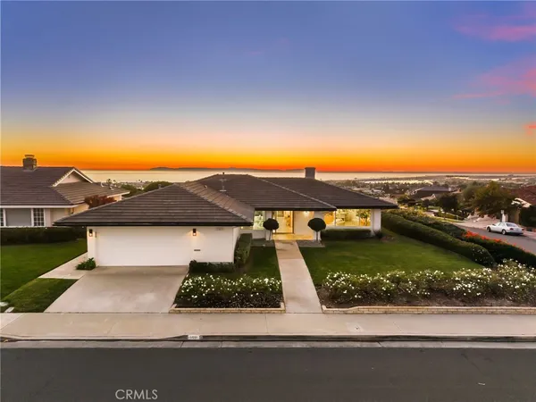 an aerial view of a house with a garden