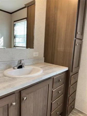 a bathroom with a sink and a mirror