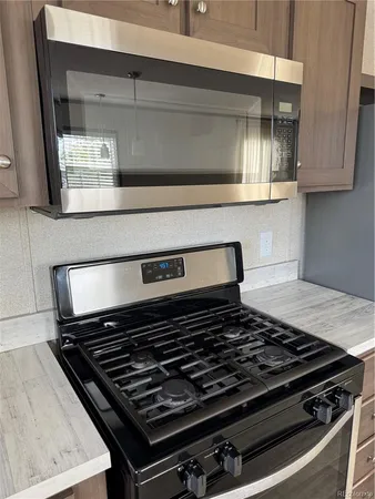 a stove sitting inside of a kitchen