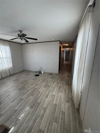 a view of a room with wooden floor