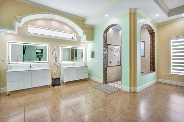 a bathroom with a sink mirror and toilet