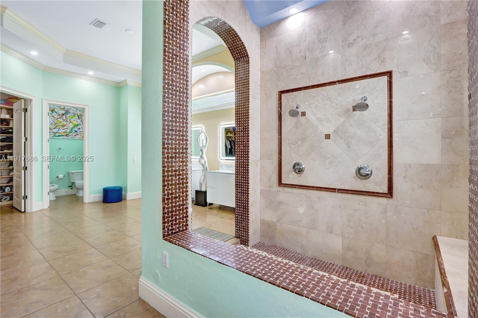 20455 Southwest 154th Avenue Miami, FL 33187 - Photo 20 of 95 a view of a hallway with paintings on the wall