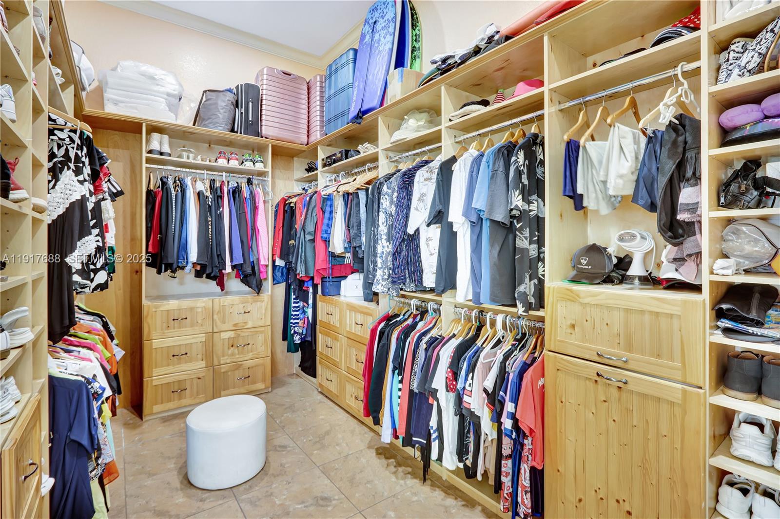 20455 Southwest 154th Avenue Miami, FL 33187 - Photo 23 of 95 a view of walk in closet with clothes