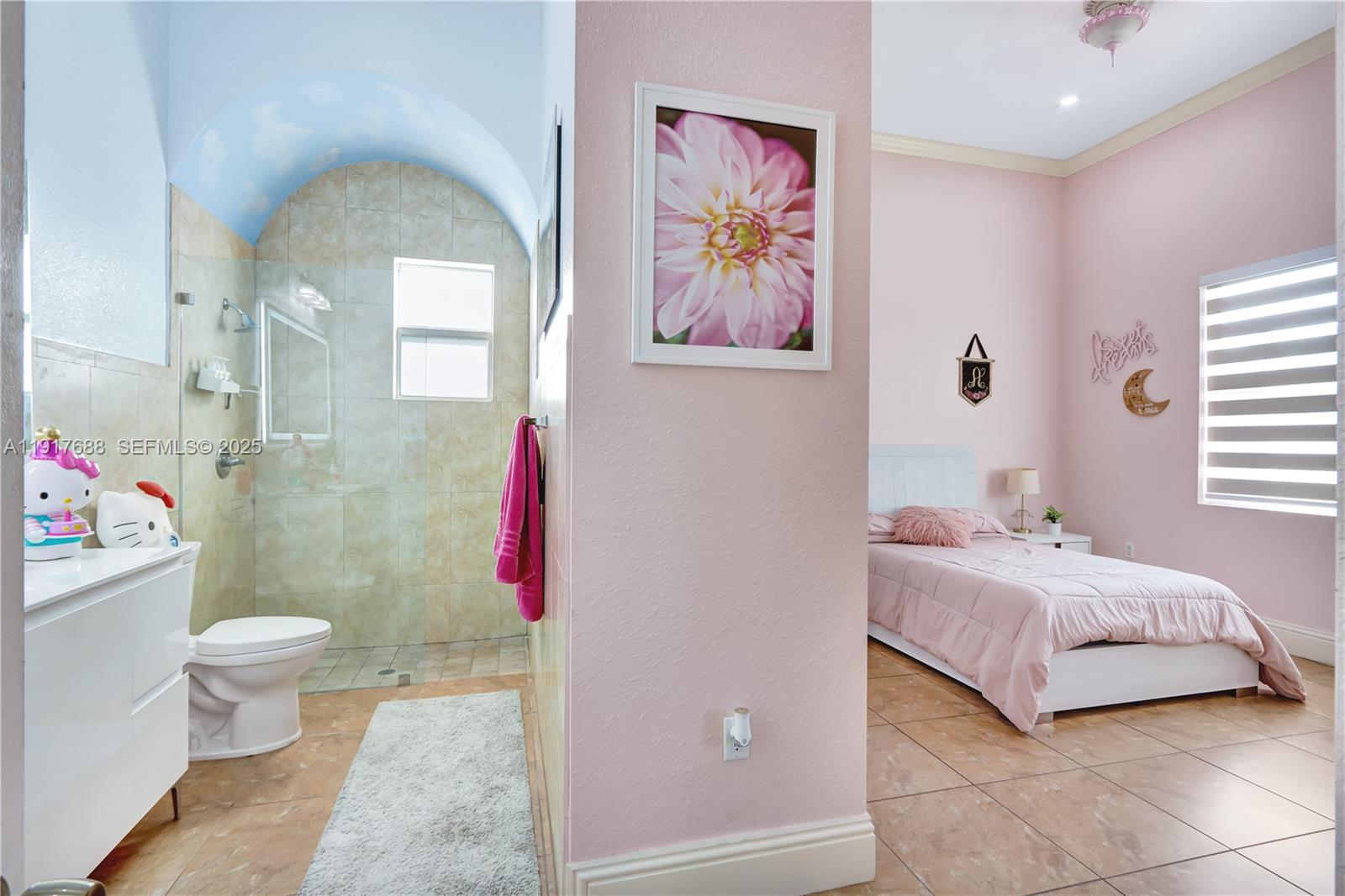 20455 Southwest 154th Avenue Miami, FL 33187 - Photo 28 of 95 a bedroom with a bed and a painting on the wall