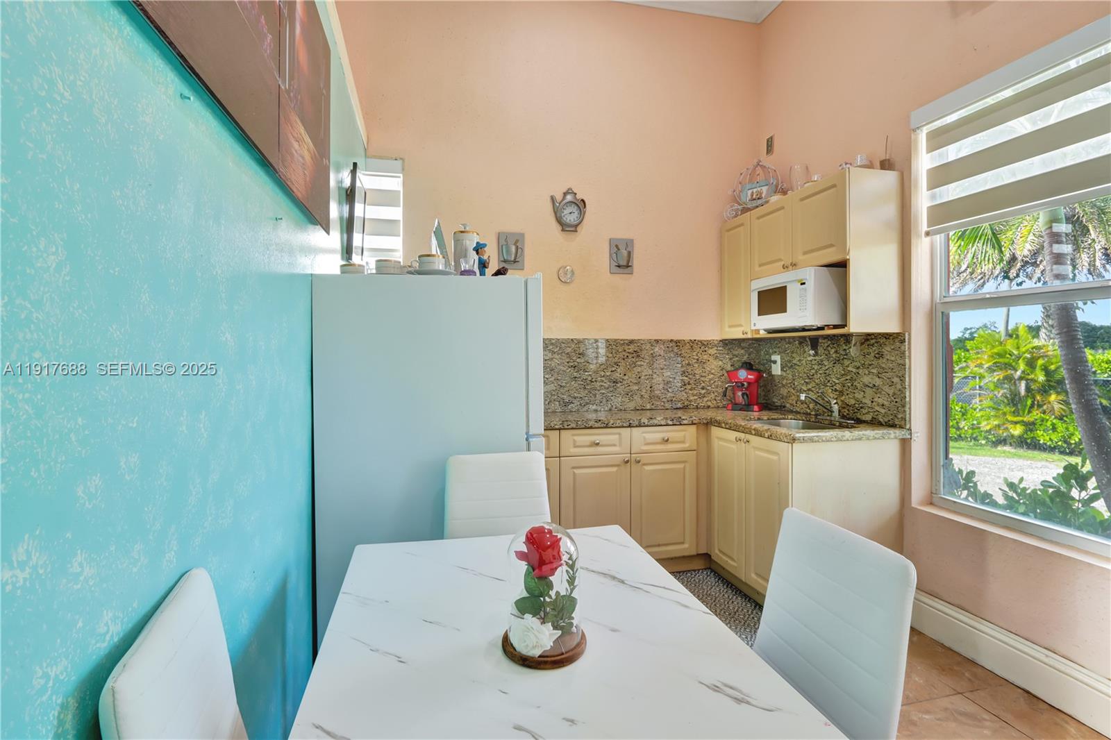 20455 Southwest 154th Avenue Miami, FL 33187 - Photo 33 of 95 a kitchen with stainless steel appliances granite countertop a refrigerator sink and white cabinets