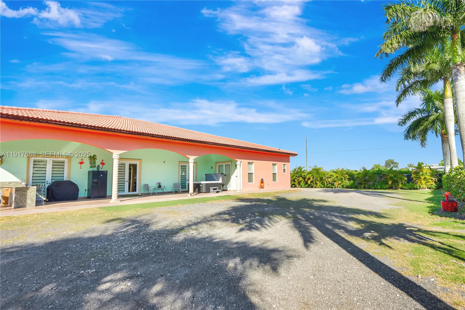 20455 Southwest 154th Avenue Miami, FL 33187 - Photo 39 of 95 a view of a large building with palm trees