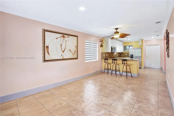 a building outdoor space with patio furniture and potted plants