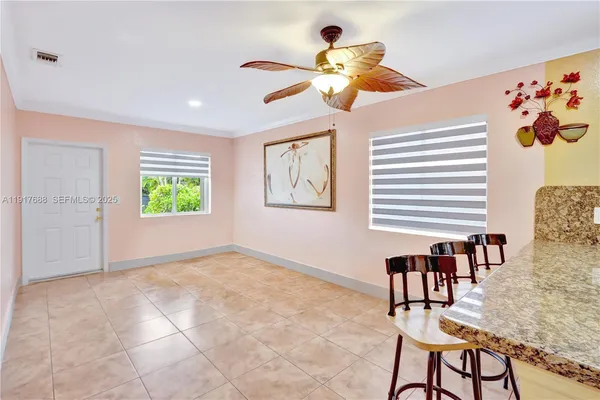 a view of swimming pool with seating space