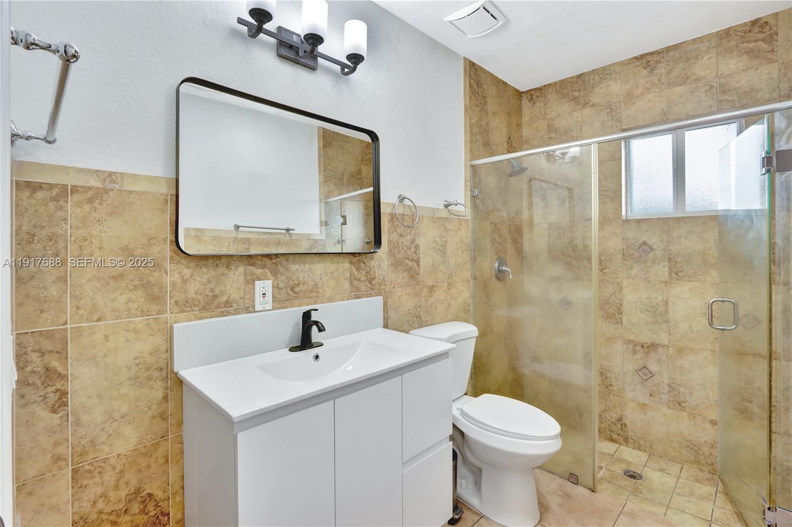 20455 Southwest 154th Avenue Miami, FL 33187 - Photo 45 of 95 a bathroom with a toilet sink and mirror