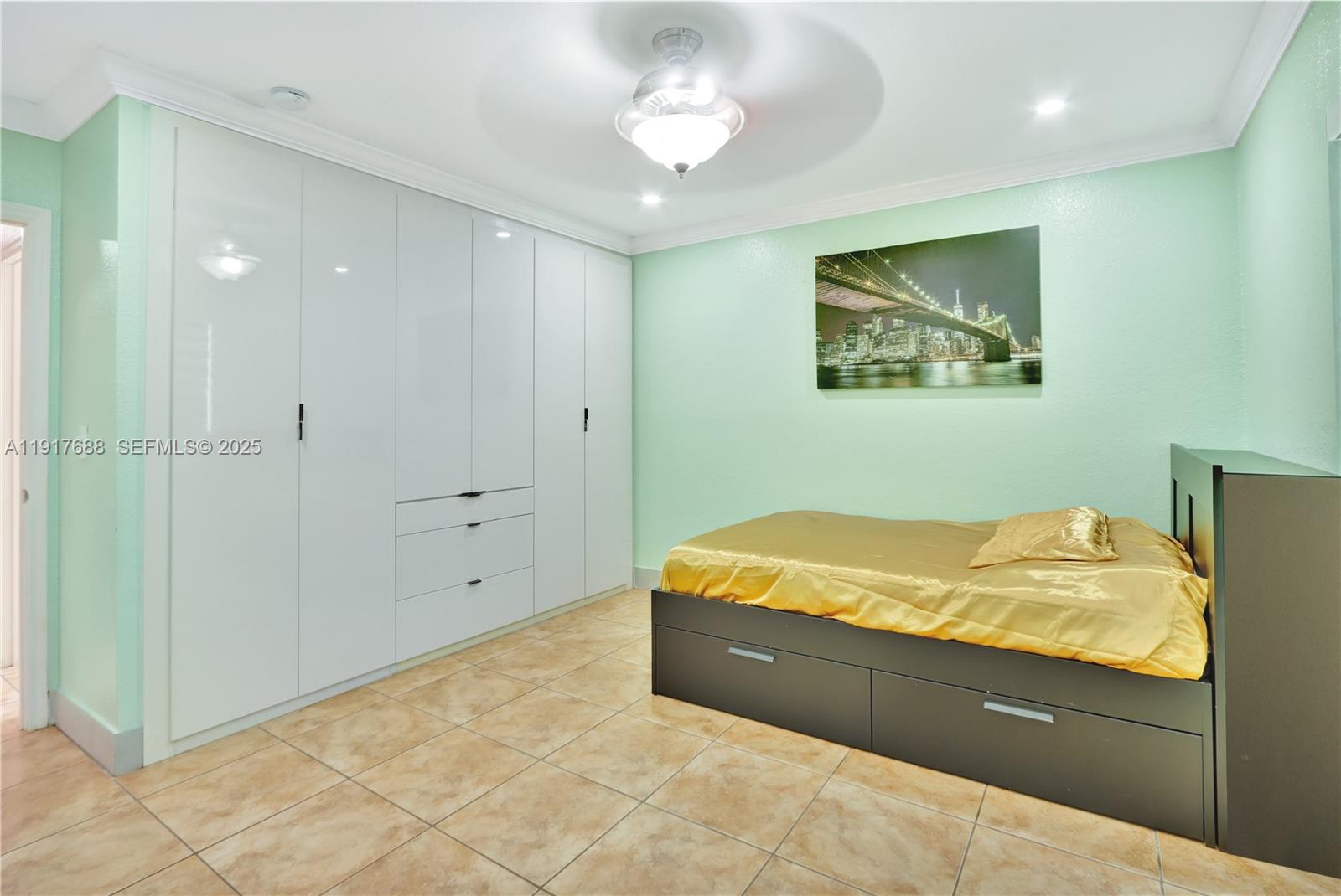 20455 Southwest 154th Avenue Miami, FL 33187 - Photo 47 of 95 a bed room with a bed and a painting