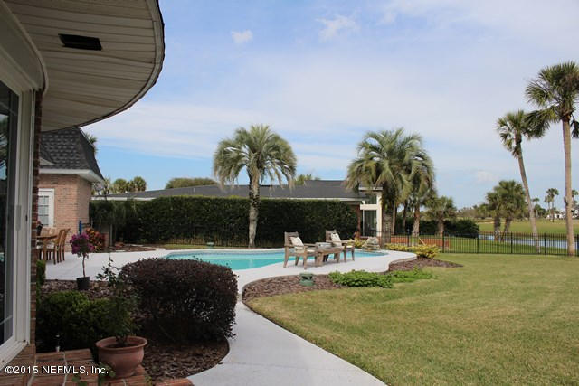 335 Pablo Road Ponte Vedra Beach, FL 32082 - Photo 66 of 67 a swimming pool with outdoor seating and yard