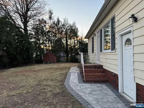 a view of a back yard of the house
