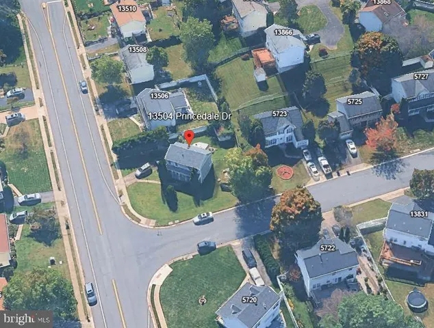 an aerial view of a house with a swimming pool