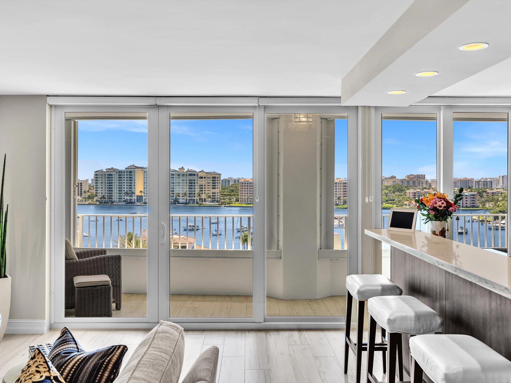 500 South Ocean Boulevard, Unit 909 Boca Raton, FL 33432 - Photo 11 of 101 a living room with furniture and a floor to ceiling window